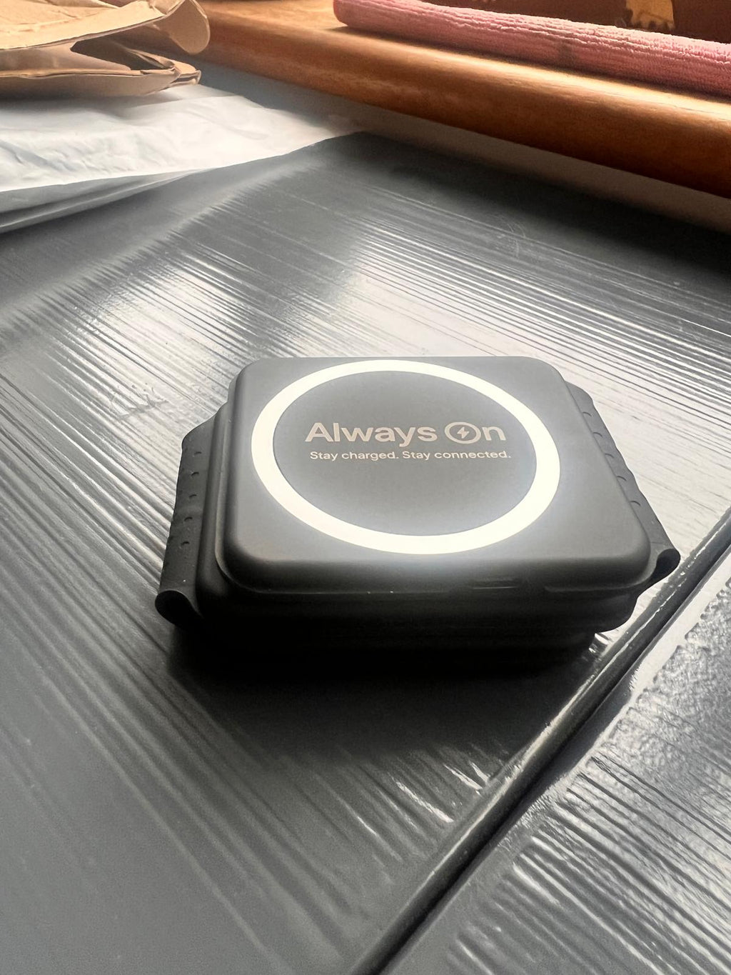 Always On 3-in-1 Wireless Charging Station in use on bedside table